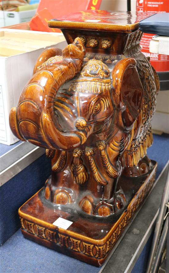 A Chinese brown glazed elephant garden seat height 56cm width 54cm